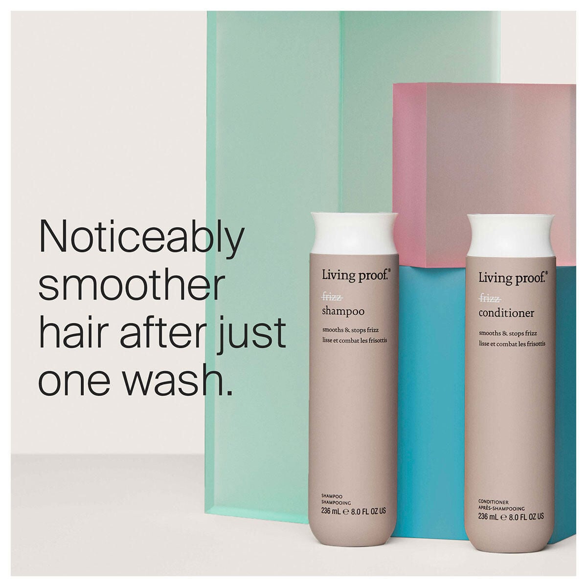 Living Proof shampoo and conditioner bottles displayed with turquoise and mauve geometric background panels, 8 oz sizes sh...